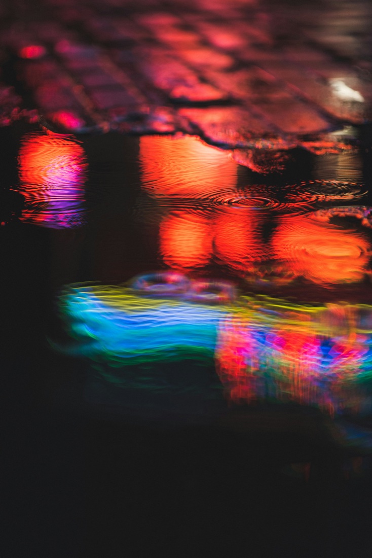 Neon reflections on a wet street